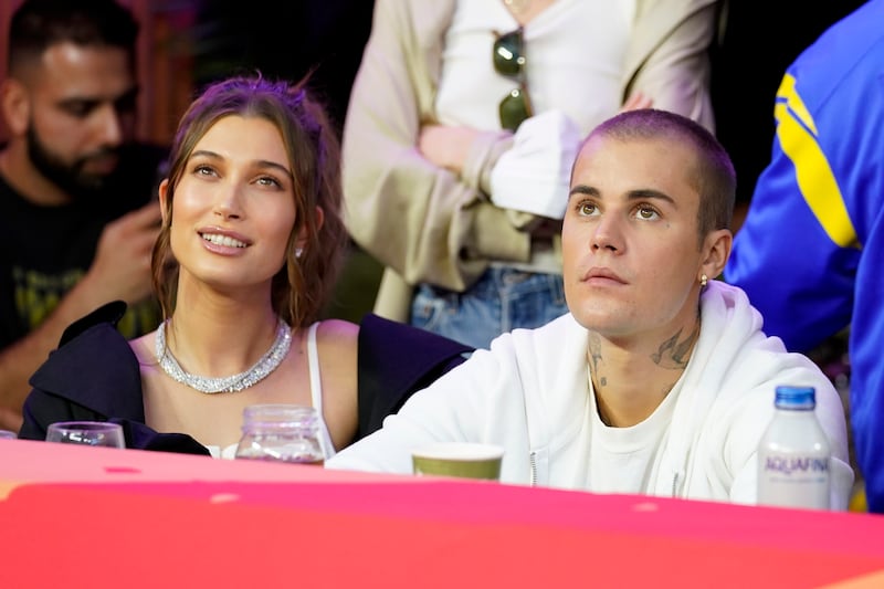 Justin Bieber and his wife, Hailey, watching the half-time show. AP