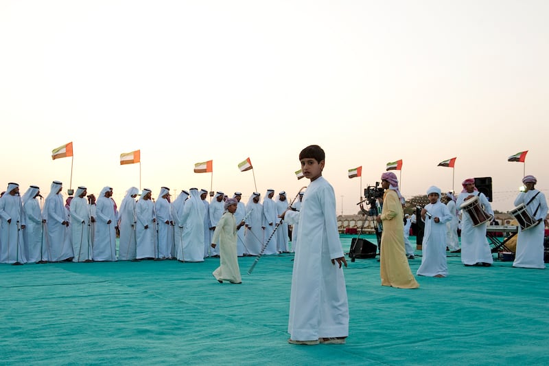 Al Dhaid, Jan 13th, 2012 -- A group of youth and men perform Ayyala, an Arabic ancient song and dance form that emulates battle. A mass wedding of 68 bridegrooms from the Central Region of the emirate of Sharjah took place in Al Dhaid January 13, 2012.