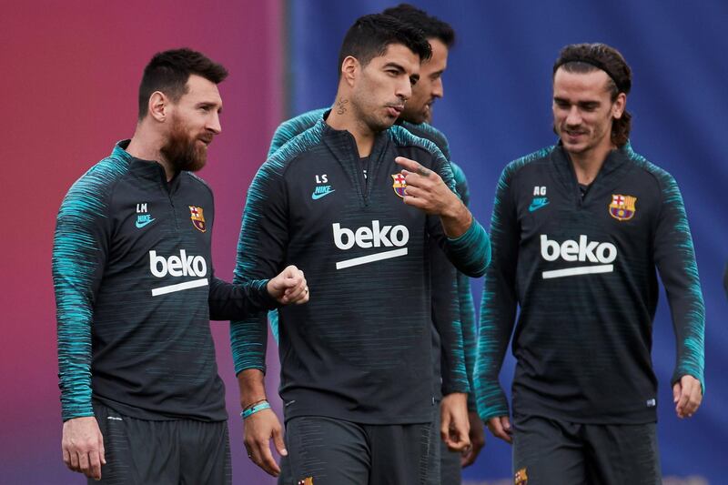 epa07940241 (L-R) FC Barcelona's Leo Messi , Luis Suarez and Antoine Griezmann attend a team's training session at Joan Gamper sport complex in Sant Joan Despi, Barcelona, Spain, 22 October 2019. The club prepares its upcoming UEFA Champions League group round soccer match against Slavia Prague at Prague's Eden Arena Stadium on 23 October.  EPA/Alejandro Garcia