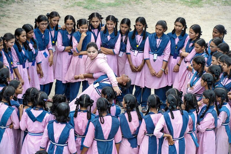 International karate champion Syeda Falak shows self-defence techniques to students at the Telangana Minorities Residential Girls School in Hyderabad, India. AFP