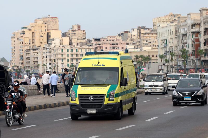 An ambulance leaves the site in Alexandria where a policeman opened fire on Israeli tourists. AP Photo