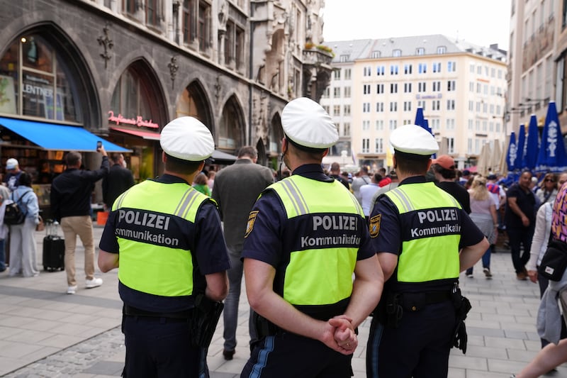 Police patrol as Scotland fans gather at Marienplatz central square in Munich. PA

