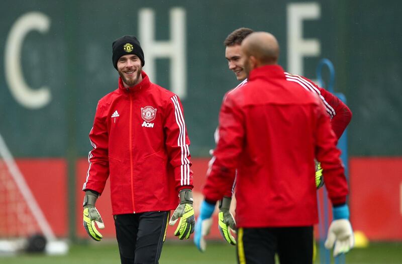 Goalkeeper David de Gea (left) during the training session. PA