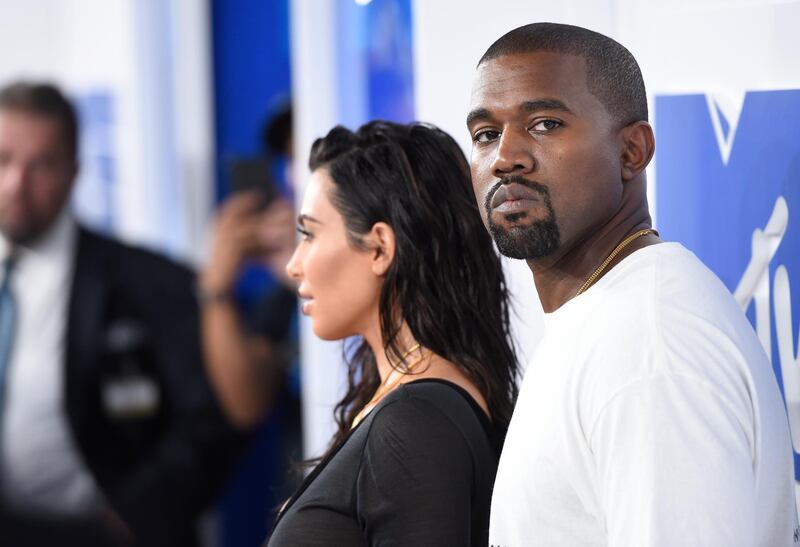 FILE - In this Aug. 28, 2016 file photo, Kim Kardashian West, left, and Kanye West arrive at the MTV Video Music Awards in New York. Kanye West will visit the White House on Thursday to meet with President Donald Trump and his son-in-law Jared Kushner talk about manufacturing in America, gang violence, prison reform and Chicago violence. (Photo by Evan Agostini/Invision/AP, File)