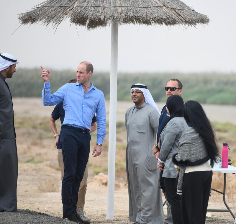 Prince William Duke of Cambridge, left, talks to officials at the al Jahra Nature Reserve outside Kuwait city. AP Photo