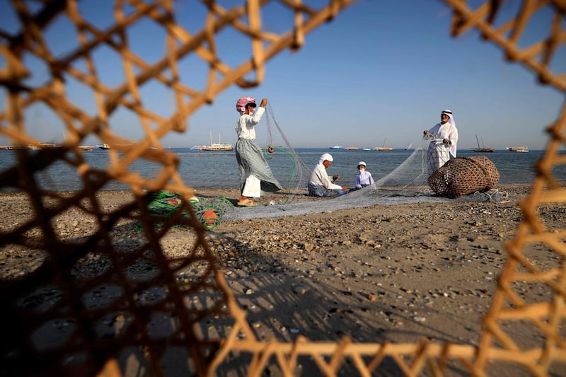 Fishermen set up nets on the shores of Dalma island in the Arabian Gulf off the coast of Abu Dhabi. AFP