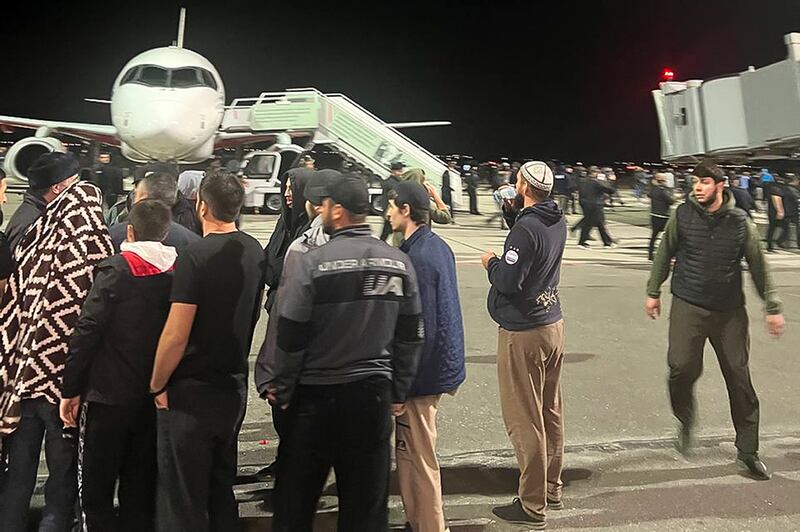 An anti-Israel crowd gathers at Makhachkala airport in the Dagestan region of southern Russia. News agencies and social media said hundreds of protesters stormed into the airport and on to its landing field, searching for people coming from a Tel Aviv flight. AP