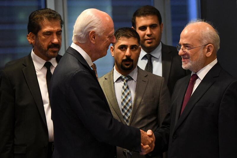 Iraqi Foreign Minister Ibrahim al-Jaafari (R) shakes hands with UN Special Envoy of the Secretary-General for Syria Staffan de Mistura during the International Peace Institute's Annual Ministerial Dinner on the Middle East ahead of the United Nations General Assembly in Manhattan, New York City, U.S. September 23, 2018. REUTERS/Darren Ornitz