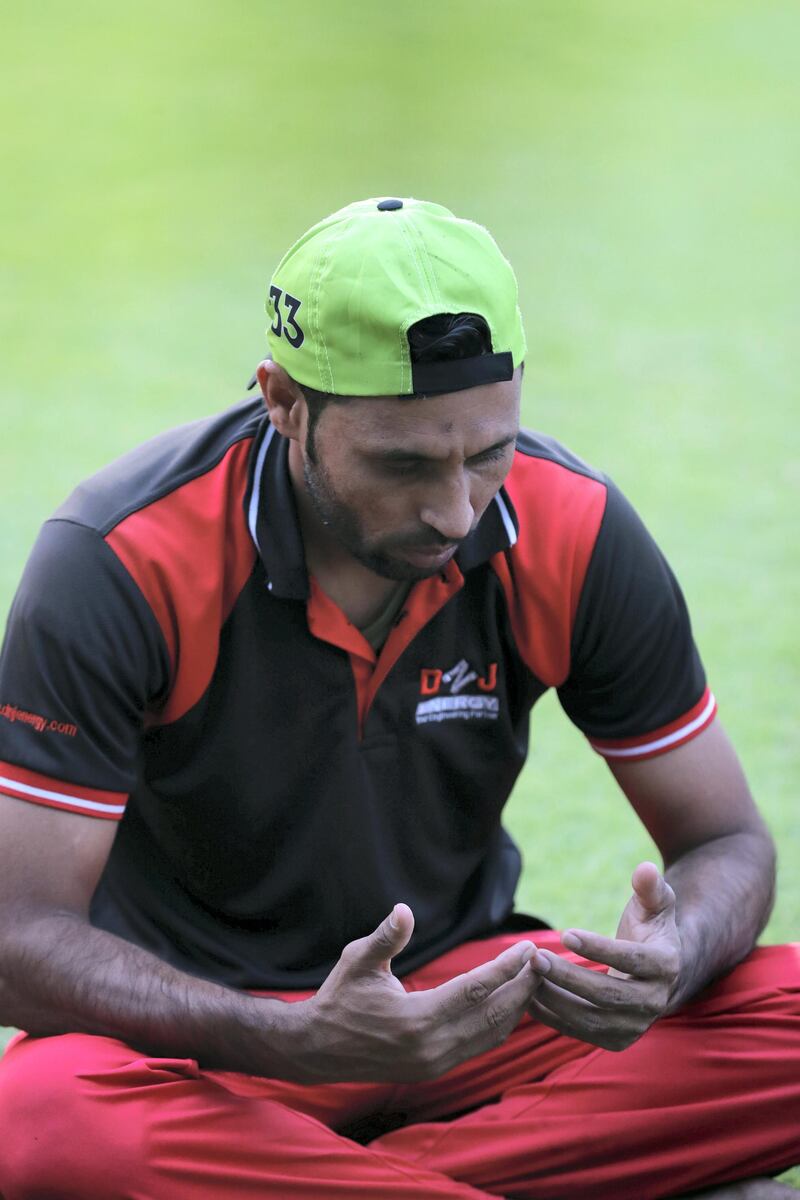 Players pray before the Sharjah Ramadan Cup game between MGM Cricket Club v Pacific Group in Sharjah on April 27th, 2021. Chris Whiteoak / The National. 
Reporter: Paul Radley for Sport