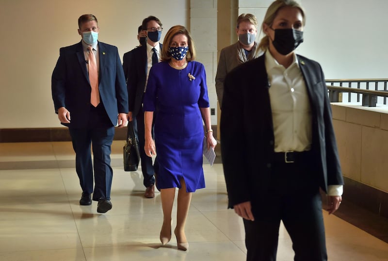 US Speaker of the House, Nancy Pelosi, Democrat of California, walks to her weekly press briefing on Capitol Hill in Washington, DC, on November 20, 2020. / AFP / Nicholas Kamm
