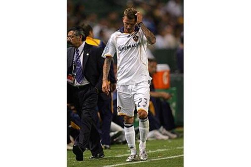 David Beckham trudges off the pitch after his red card for LA Galaxy in their 2-0 defeat to the Seattle Sounders.