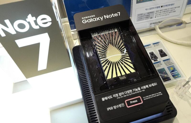 Samsung has suspended sales and production of its Galaxy Note 7 smartphones and told owners to stop using them after reports of fires in replacement devices. Jeon Heon-kyun / EPA