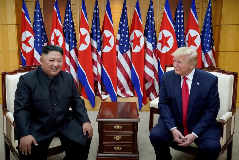 FILE PHOTO: U.S. President Donald Trump meets with North Korean leader Kim Jong Un at the demilitarized zone separating the two Koreas, in Panmunjom, South Korea, June 30, 2019. REUTERS/Kevin Lamarque/File Photo