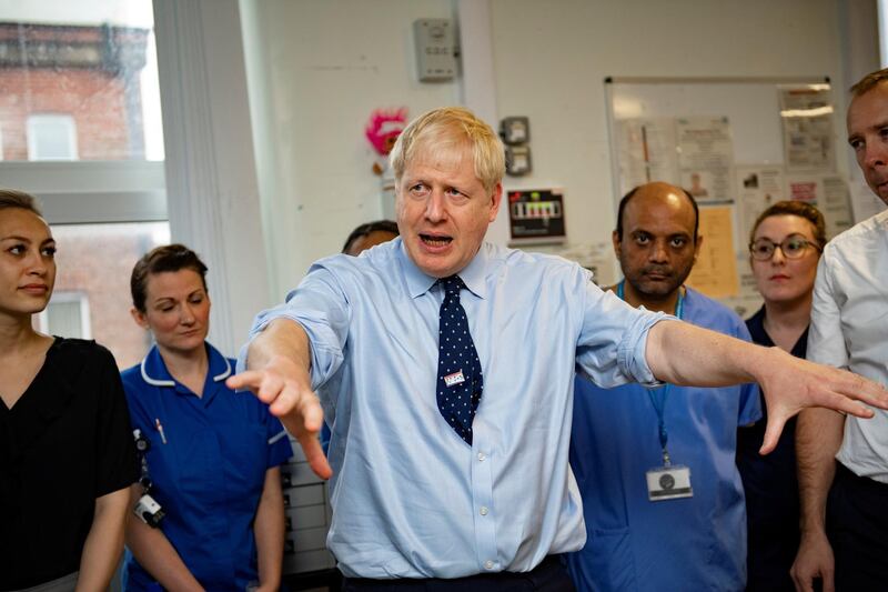 FILE PHOTO: Britain's Prime Minister Boris Johnson visits the North Manchester General Hospital before the start of Conservative Conference, in Manchester, Britain September 29, 2019. Andy Stenning/Pool via REUTERS/File Photo