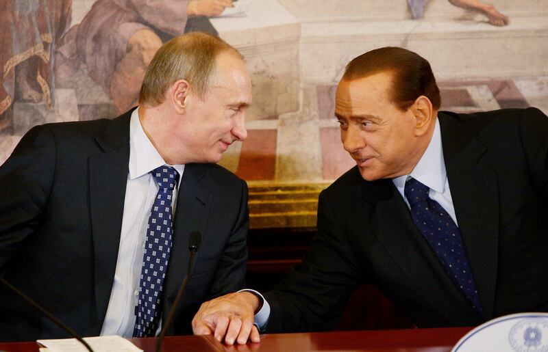 Vladimir Putin and Berlusconi attend a press conference in 2010 in Lesmo, Italy. Getty