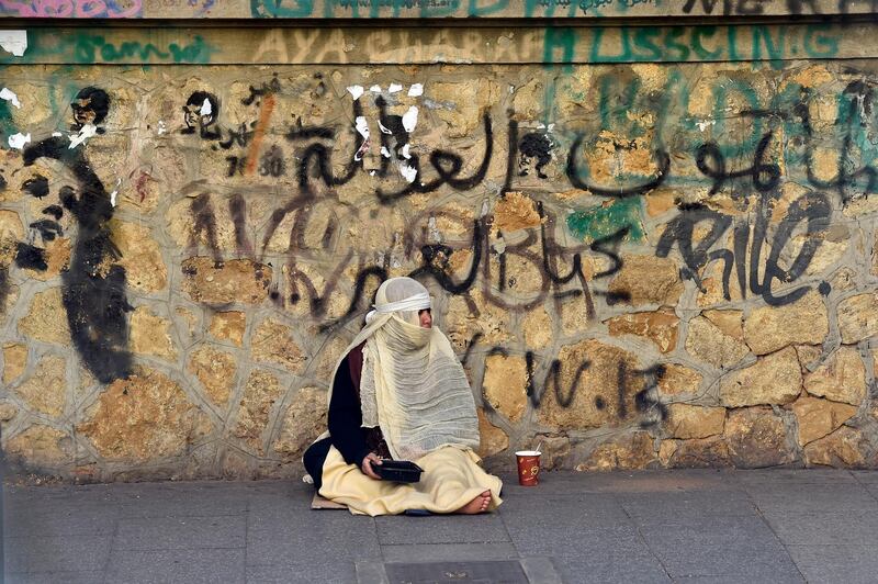 A beggar waits for alms at Hamra street in Beirut, Lebanon. EPA