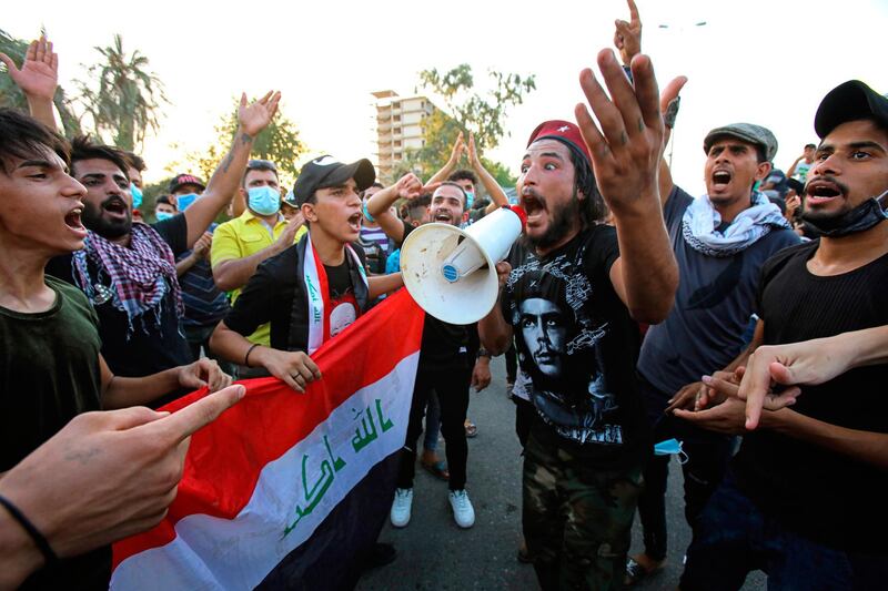 Anti-government protesters gather for a demonstration demanding better public services and against corruption outside the provincial council building, in Basra, Iraq. AP Photo