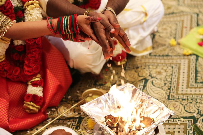 A priest from India's southern Tamil Nadu state guided the bridal couple through the ceremony