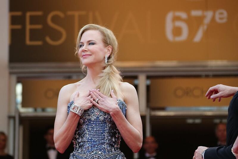Australian actress Nicole Kidman poses as she arrives for the Opening Ceremony and the screening of her film “Grace of Monaco” at the 67th edition of the Cannes Film Festival in Cannes, southern France, on May 14, 2014. Loic Venance / AFP photo
