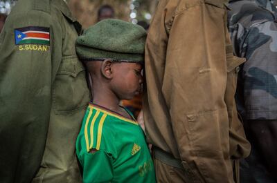 -- AFP PICTURES OF THE YEAR 2018 --

Newly released child soldiers wait in a line for their registration during the release ceremony in Yambio, South Sudan, on February 7, 2018. More than 300 child soldiers, including 87 girls, have been released in South Sudan's war-torn region of Yambio under a programme to help reintegrate them into society, the UN said on on Februar y 7, 2018. A conflict erupted in South Sudan little more than two years after gained independence from Sudan in 2011, causing tens of thousands of deaths and uprooting nearly four million people. The integration programme in Yambio, which is located in the south of the country, aims at helping 700 child soldiers return to normal life. - 
 / AFP / Stefanie Glinski
