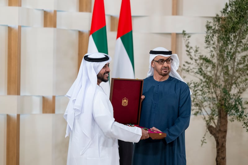 President Sheikh Mohamed presents a Zayed the Second Medal to Ahmad Abdulrahman Al Ghardaqa