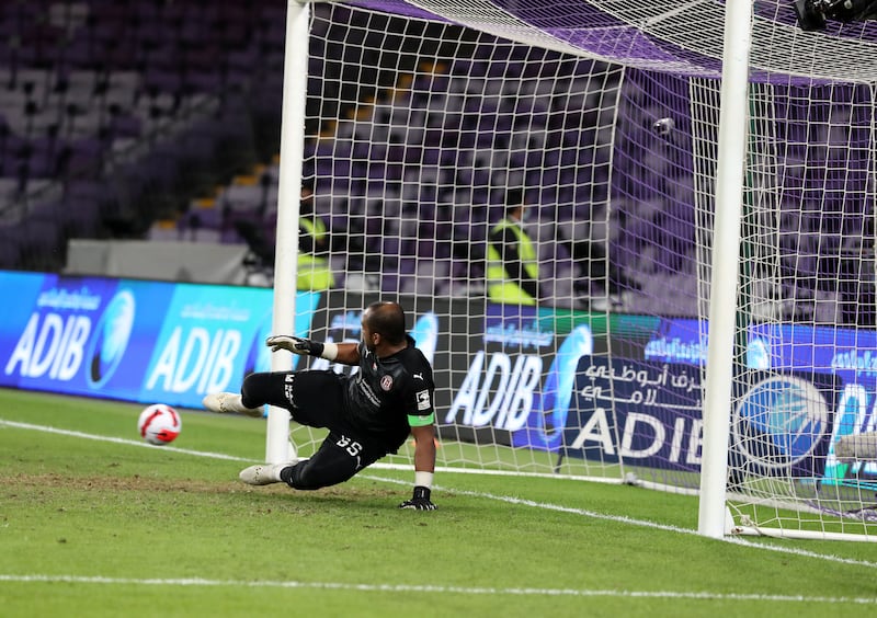 Ali Khaseif of Al Jazira watches as a penalty by Abdulla Ali Hassan of Shabab Al Ahli goes wide.