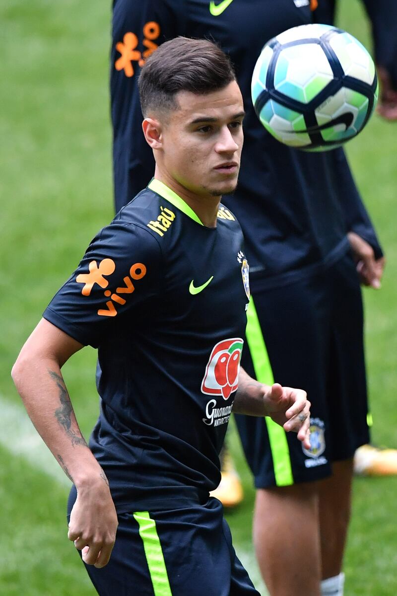 Brazilian footballer Philippe Coutinho takes part in a training session on the eve of their 2018 FIFA Russia World Cup qualifier football match against Ecuador, at the Arena Gremio stadium in Porto Alegre, Brazil on August 30, 2017. / AFP PHOTO / NELSON ALMEIDA