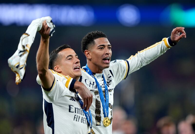 Lucas Vazquez and Jude Bellingham celebrate after Real Madrid win the Uefa Champions League final against Borussia Dortmund at Wembley Stadium in London. PA