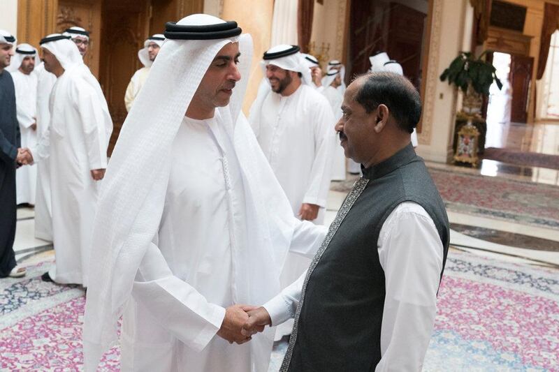 Sheikh Saif bin Zayed, Deputy Prime Minister and Minister of Interior, shakes the hand of  Paninkonhi Mohiuddin, a man who has been working at Abu Dhabi Crown Prince Court for more than 40 years. Courtesy Crown Prince Court - Abu Dhabi
