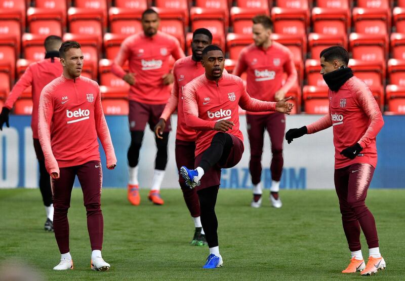 Barcelona players warm up ahead of the training session at Anfield. EPA