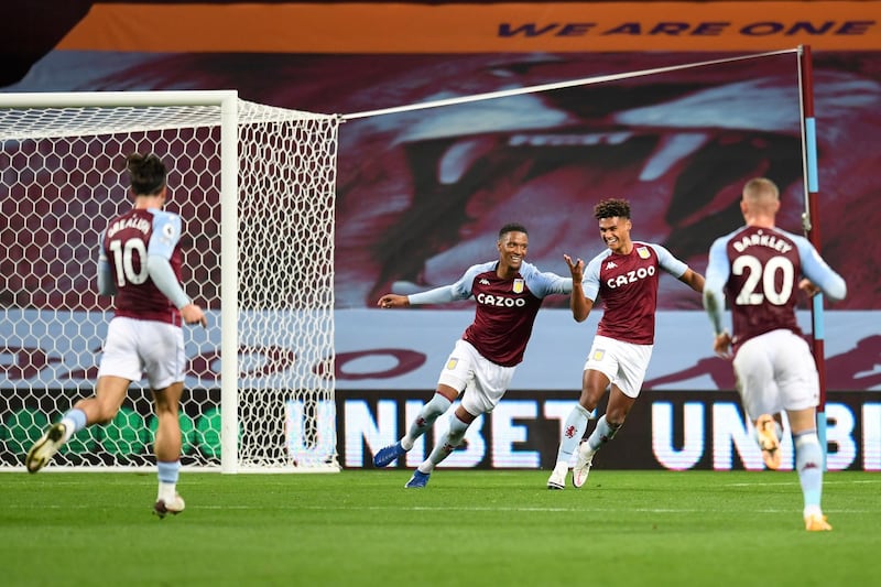 Aston Villa's Ollie Watkins, second right, celebrates after scoring his side's fourth goal. AP