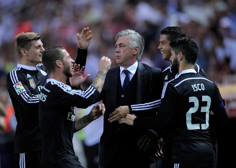 SEVILLE, SPAIN - MAY 02:  Cristiano Ronaldo of Real Madrid celebrates with Head coach Carlo Ancelotti after scoring his team's 3rd goal during the La Liga match between Sevilla FC and Real Madrid CF at Estadio Ramon Sanchez Pizjuan on May 2, 2015 in Seville, Spain.  (Photo by Denis Doyle/Getty Images)
