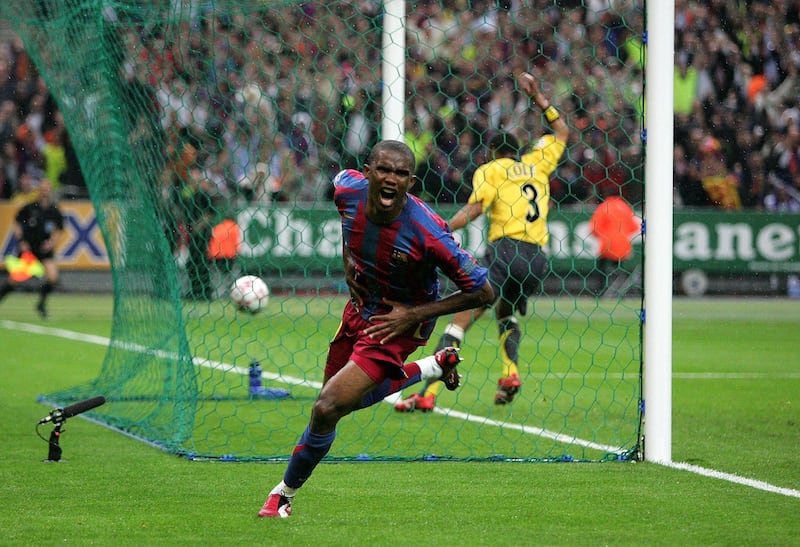 PARIS - MAY 17:  Samuel Eto?o of Barcelona celebrates scoring the equalising goal during the UEFA Champions League Final between Arsenal and Barcelona at the Stade de France on May 17, 2006 in Paris, France.  (Photo by Mike Hewitt/Getty Images)