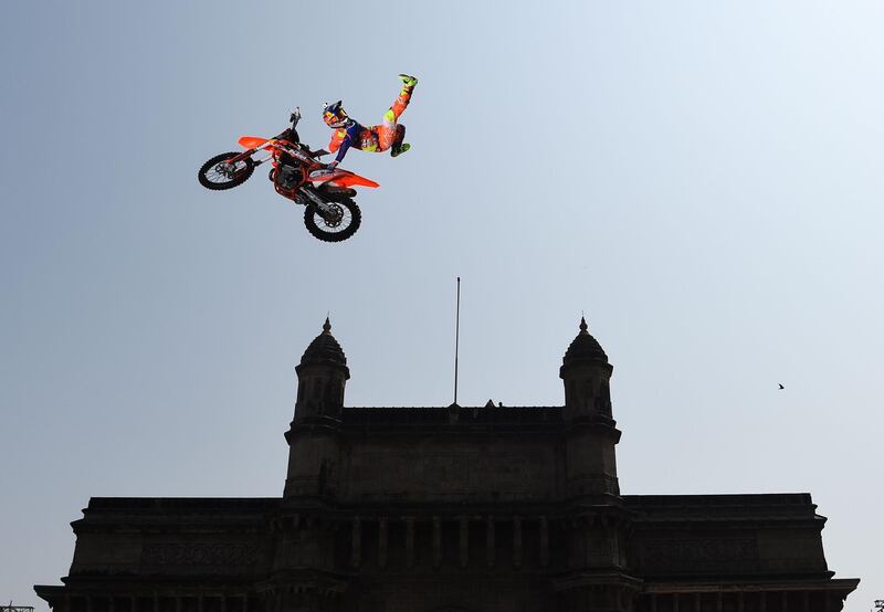 A Freestyle Motocross (FMX) rider performs stunts during the Red Bull FMX Jam 2019 at the Gateway of India in Mumbai.  AFP