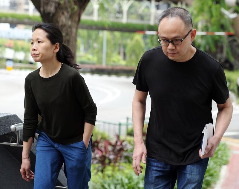 Lim Choon Hong and his wife Chong Sui Foon, accused of starving their Filipino maid, arrive at the state court in Singapore on March 27, 2017. The Straits Times / Wong Kwai Chow/ AFP