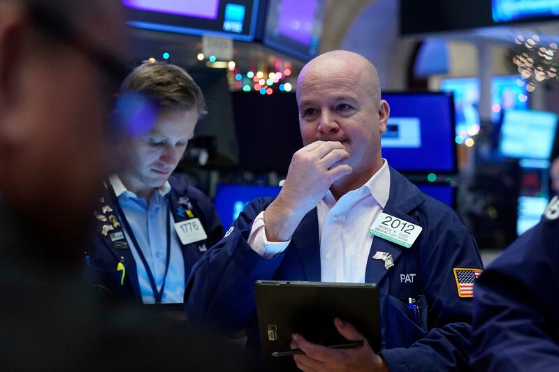 Traders work at the New York Stock Exchange. About $65 billion has been raised through IPOs around the world in 2022, down 70 per cent from $219bn in the first three months of last year. AP