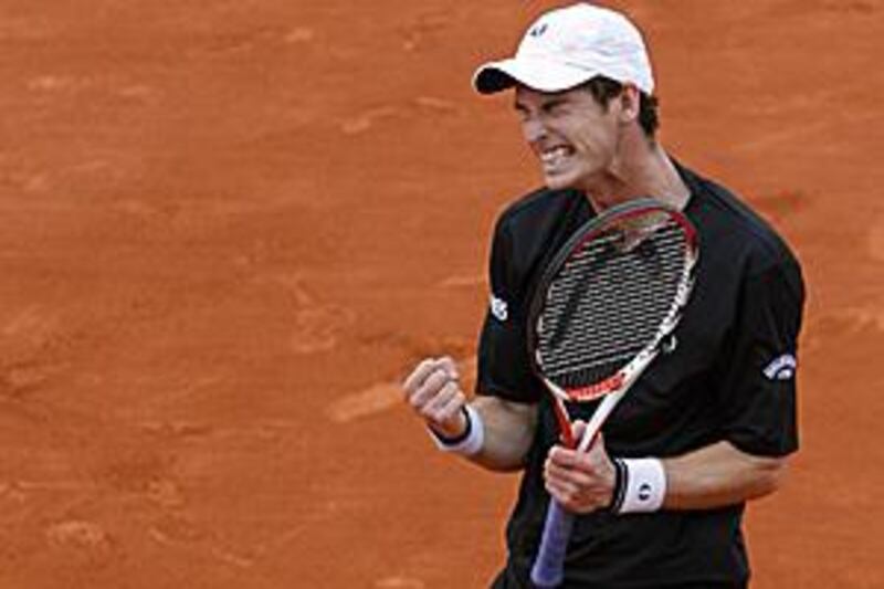 Andy Murray clenches his fist with delight after dispatching Marin Cilic and making it to the quarter-final at Roland Garros for the first time.