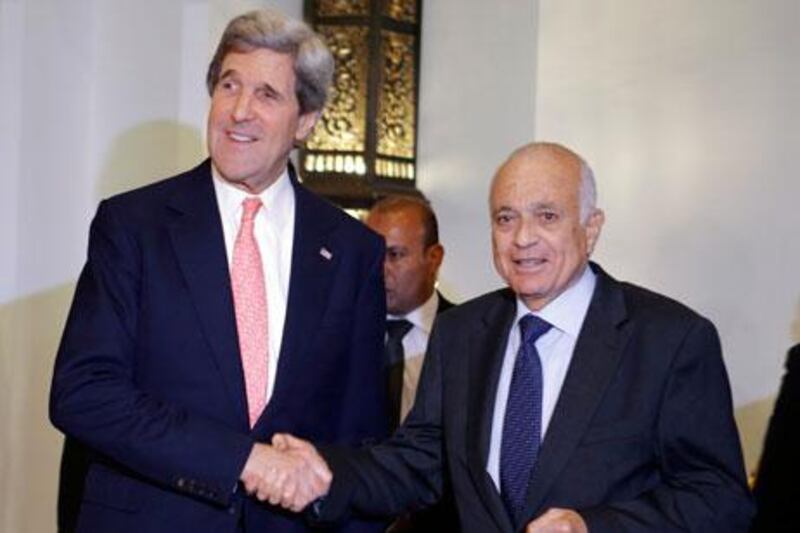 John Kerry, the US secretary of state, left, with the Arab League chief Nabil Elaraby in March. Mr Kerry returns to the region this week. AP Photo