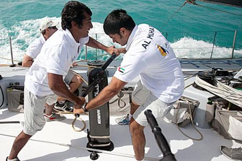 When not on the sea, Butti Al Muhairi, left, and Adil Khalid are learning the drills with the Shore Team in the workshop.