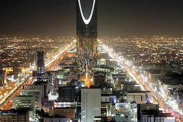 The Kingdom Tower stands in the night above the Saudi capital Riyadh November 16, 2007. REUTERS/Ali Jarekji (SAUDI ARABIA) - GM1DWPNRBQAA