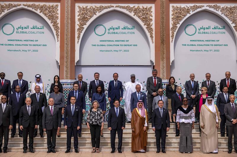 Delegates pose for a group photo before their meeting in Marrakesh.  AFP