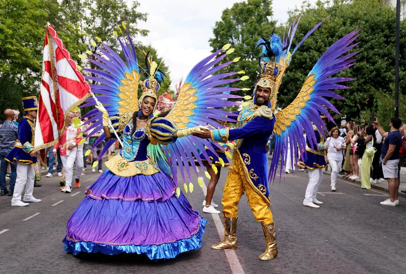 Performers participate in the newly returned carnival. PA