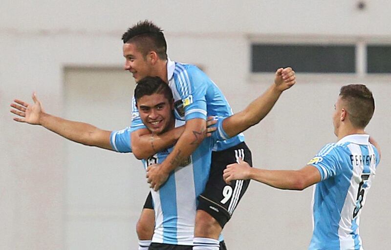 Rodrigo Moreira, left, and his Argentine teammates celebrate moving into the semi-finals at the Fifa Under 17 World Cup with a victory over Ivory Coast. EPA