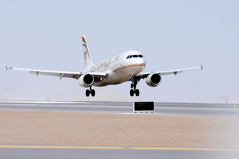 Abu Dhabi - 12th October  ,  2008 -The first plane to land on the new runway a Etihad A320 comes into land on the runway for the first time after it was opened today   , ( Andrew Parsons  /  The National )