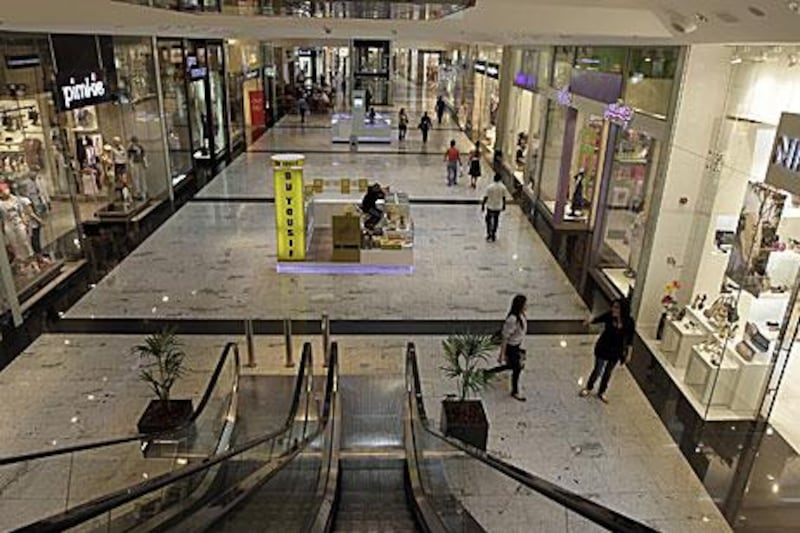 Bahrainis walk through a largely deserted mall in central Manama in March, a month after pro-democracy protests began. Retail sales stagnated in the first half of the year due to unrest in the island nation.