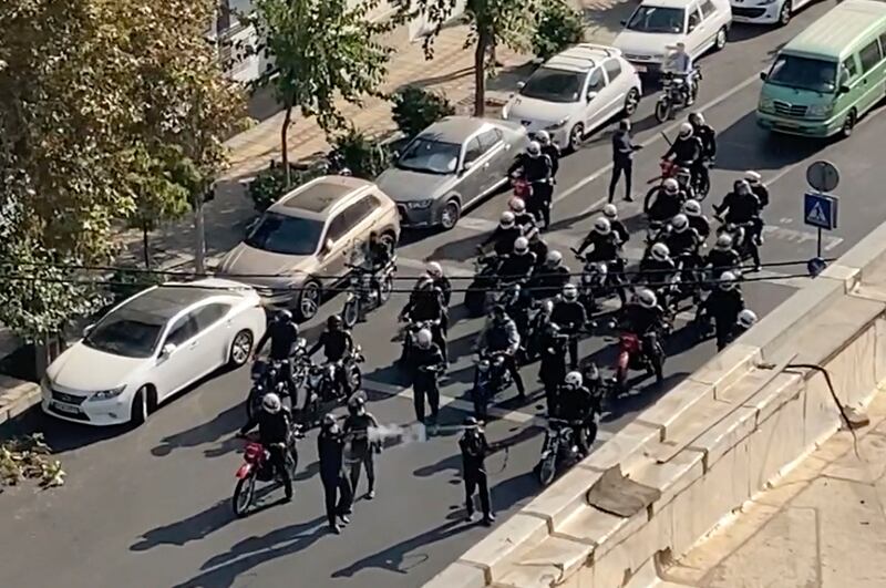 Iranian police arrive to disperse a protest marking 40 days since Amini's death. AP