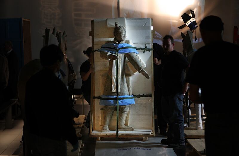 A Terracotta Warrior statue, wrapped in protective foam, is moved into place in the  Reading Room at The British Library on August 21, 2007 in London.