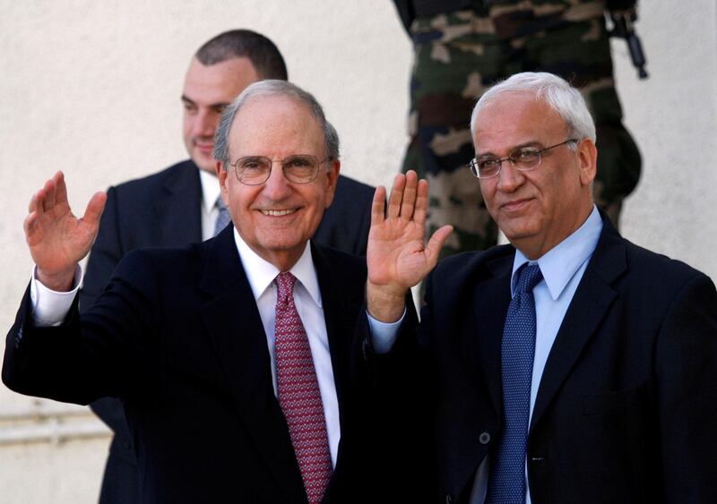 US Middle East envoy George Mitchell and chief Palestinian negotiator Saeb Erekat  wave before Mitchell's meeting with Palestinian President Mahmoud Abbas in the West Bank city of Ramallah on October 1, 2010. Reuters