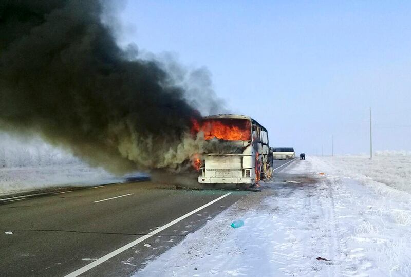 In this Kazakhstan Ministry for Emergency Situations photo, made available on Thursday, Jan. 18, 2018, a bus burns on a road in near the village of Kalybai in Kazakhstan. Kazakhstan's emergency officials say 52 people of 57 on the bus died on the fire. (Kazakhstan Ministry for Emergency Situations via AP)