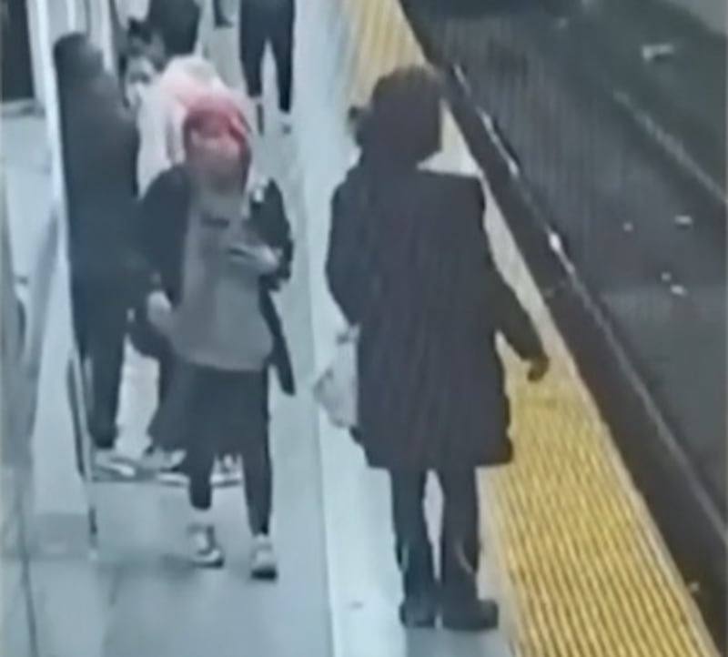A woman approaches Shamsa Al Balushi as she waits for her train home. Photo: CTV News Toronto